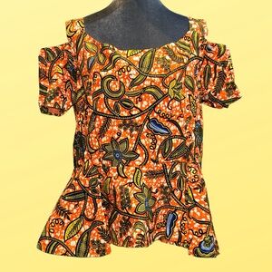 Handmade vibrant joyful African wax print fabric peek a boo sleeve peplum style
